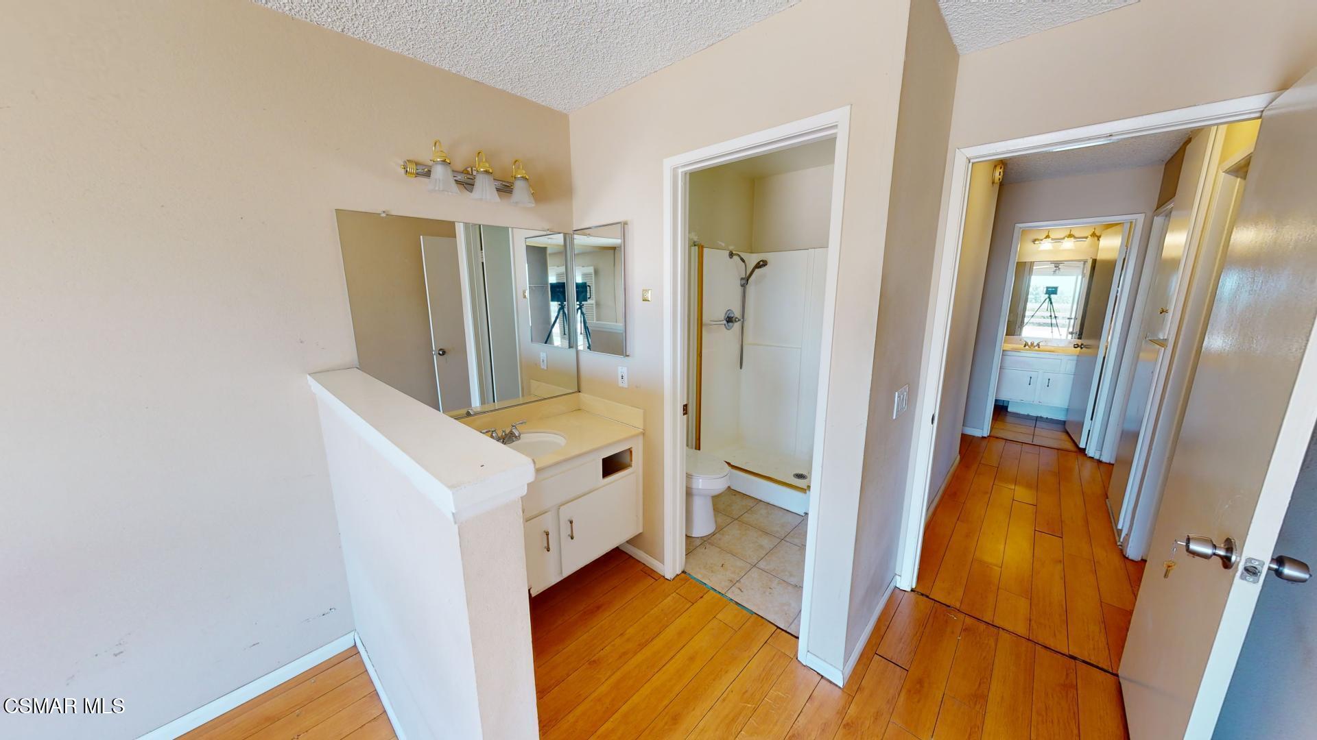 18550 Dylan Street Porter Ranch, CA 91326 - Photo 20 of 27 a view of hallway with washer and dryer