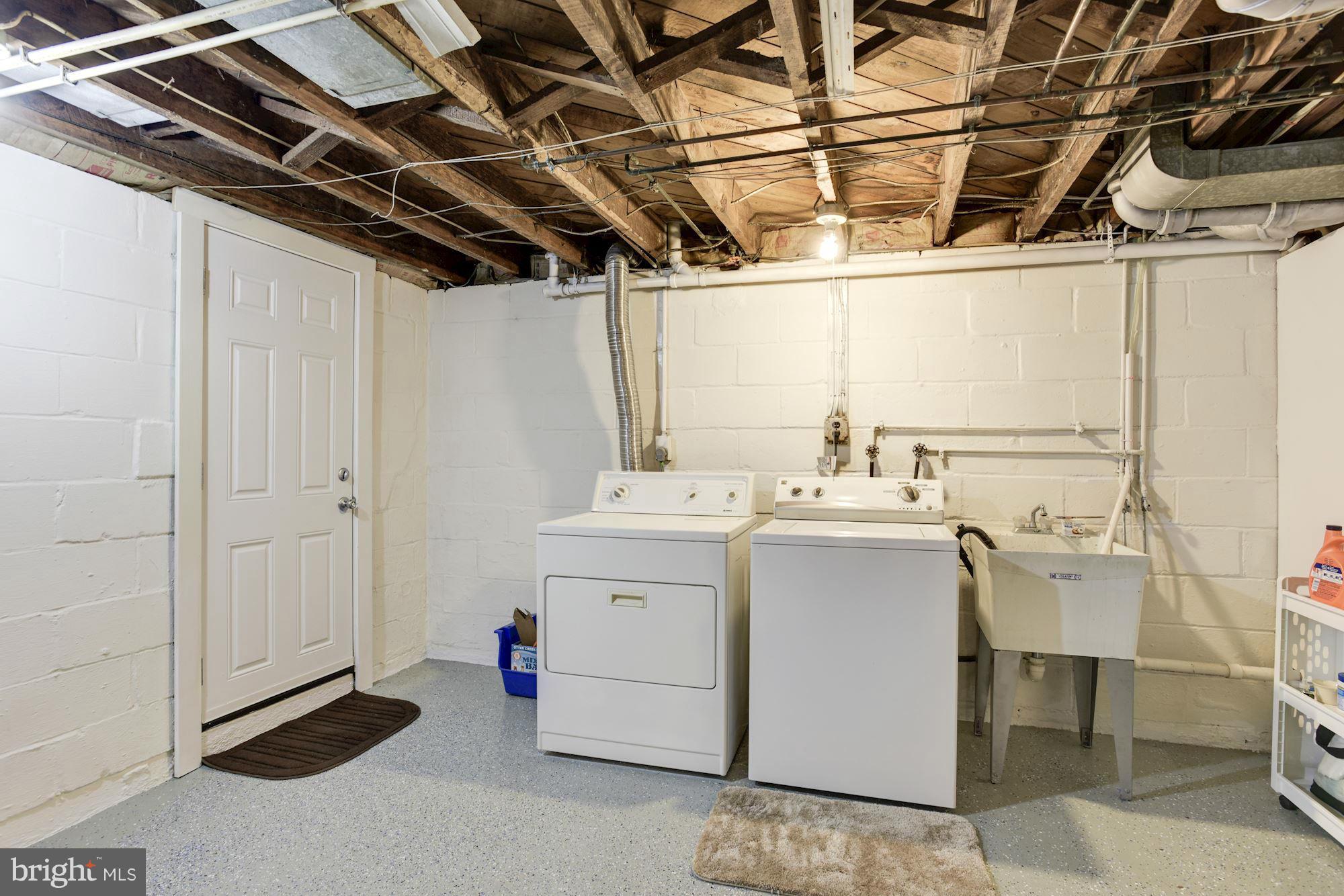 6407 Banbury Road Baltimore, MD 21239 - Photo 22 of 26 Laundry. Walk-out staircase to yard.