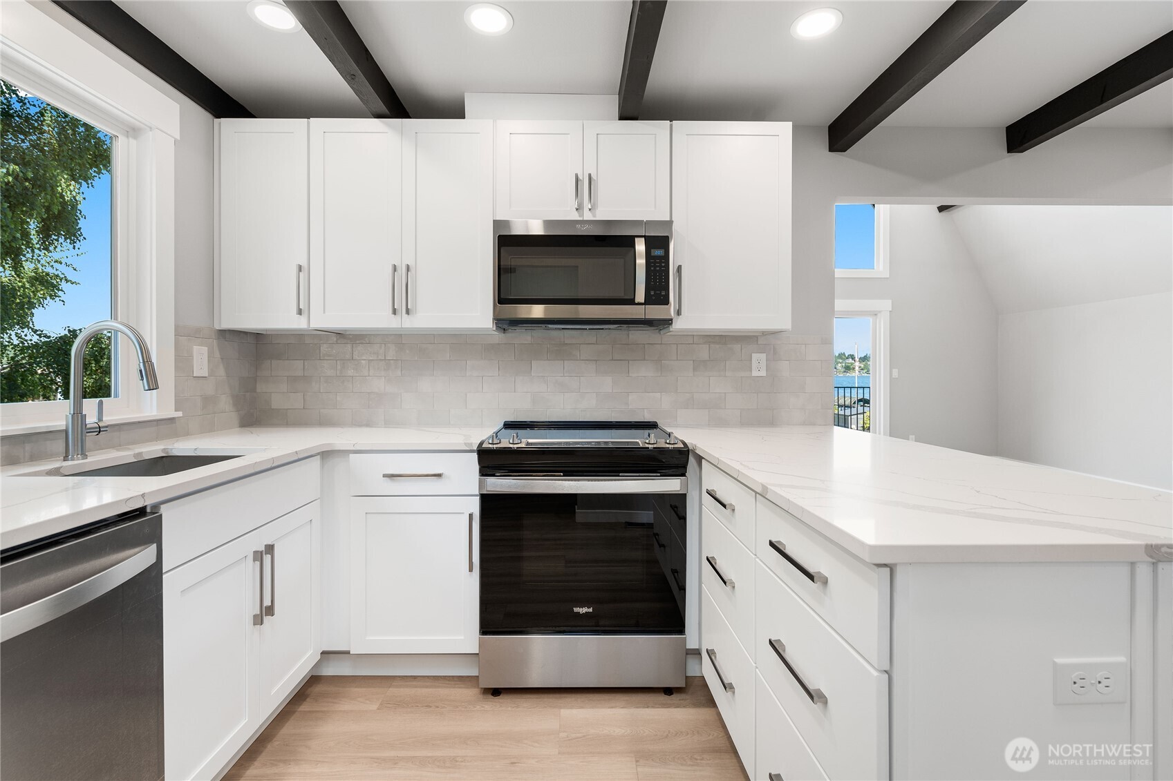 10005 North Davies Road Lake Stevens, WA 98258 - Photo 12 of 40 a kitchen with white cabinets and stainless steel appliances
