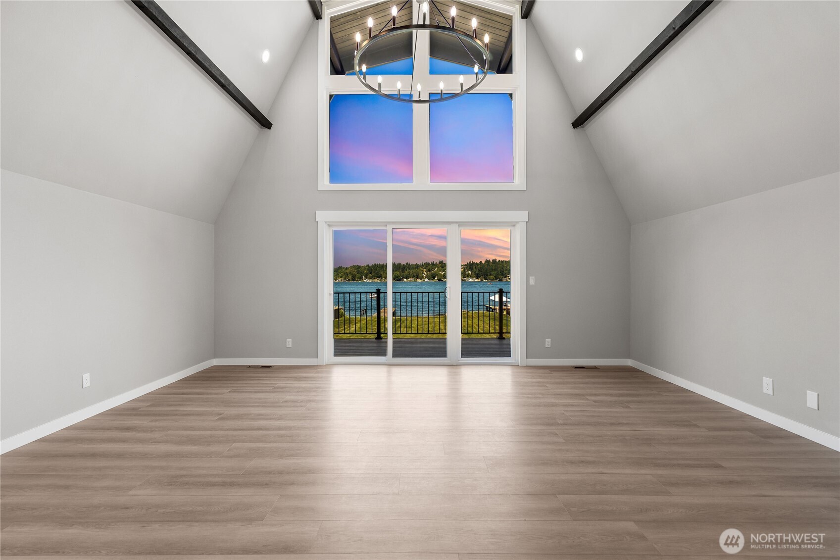 10005 North Davies Road Lake Stevens, WA 98258 - Photo 14 of 40 an empty room with wooden floor and windows