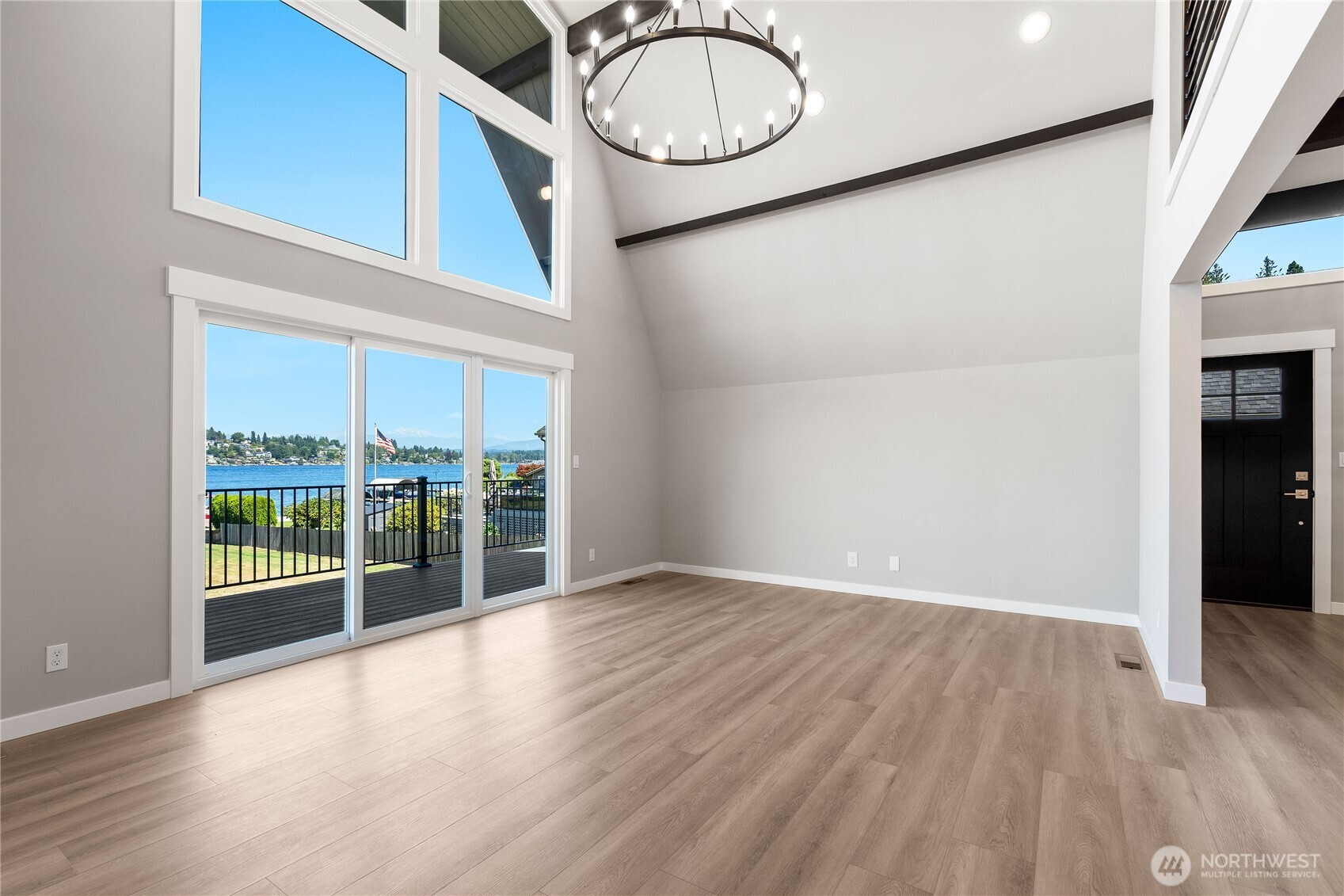10005 North Davies Road Lake Stevens, WA 98258 - Photo 15 of 40 an empty room with wooden floor and windows
