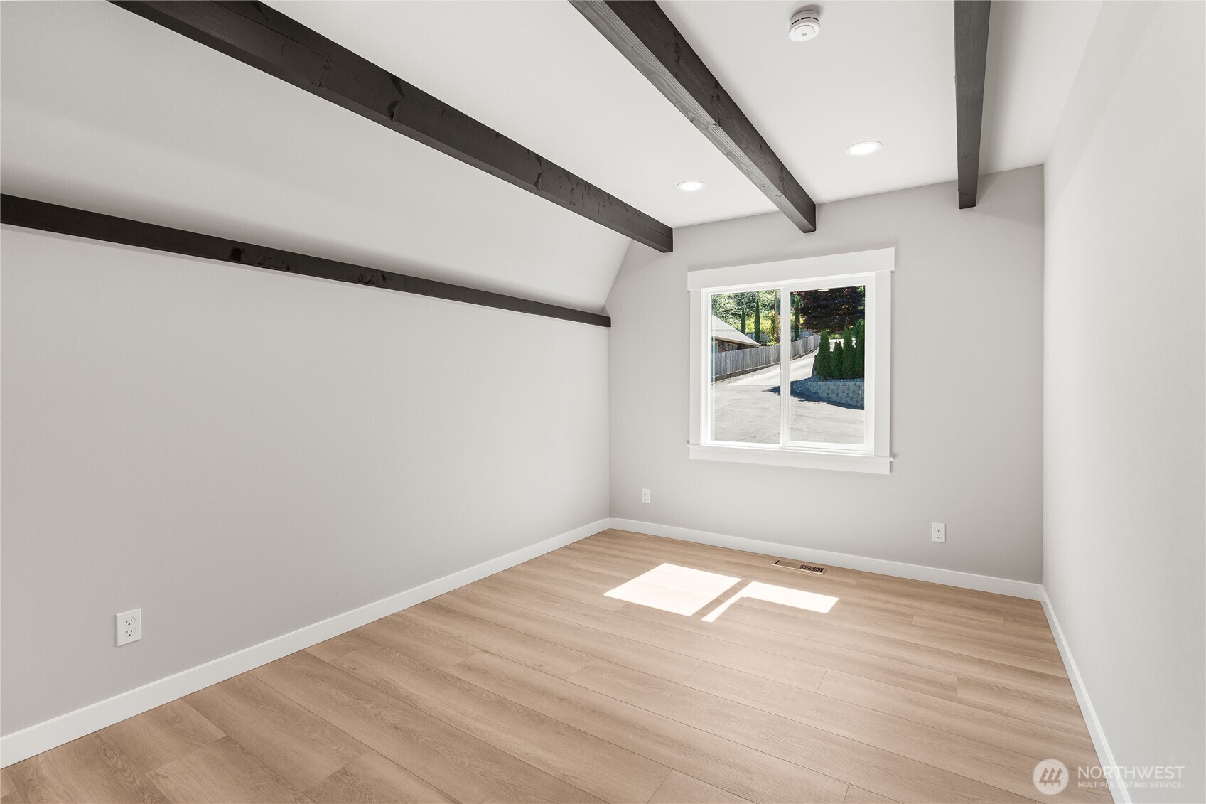 10005 North Davies Road Lake Stevens, WA 98258 - Photo 23 of 40 an empty room with wooden floor and windows