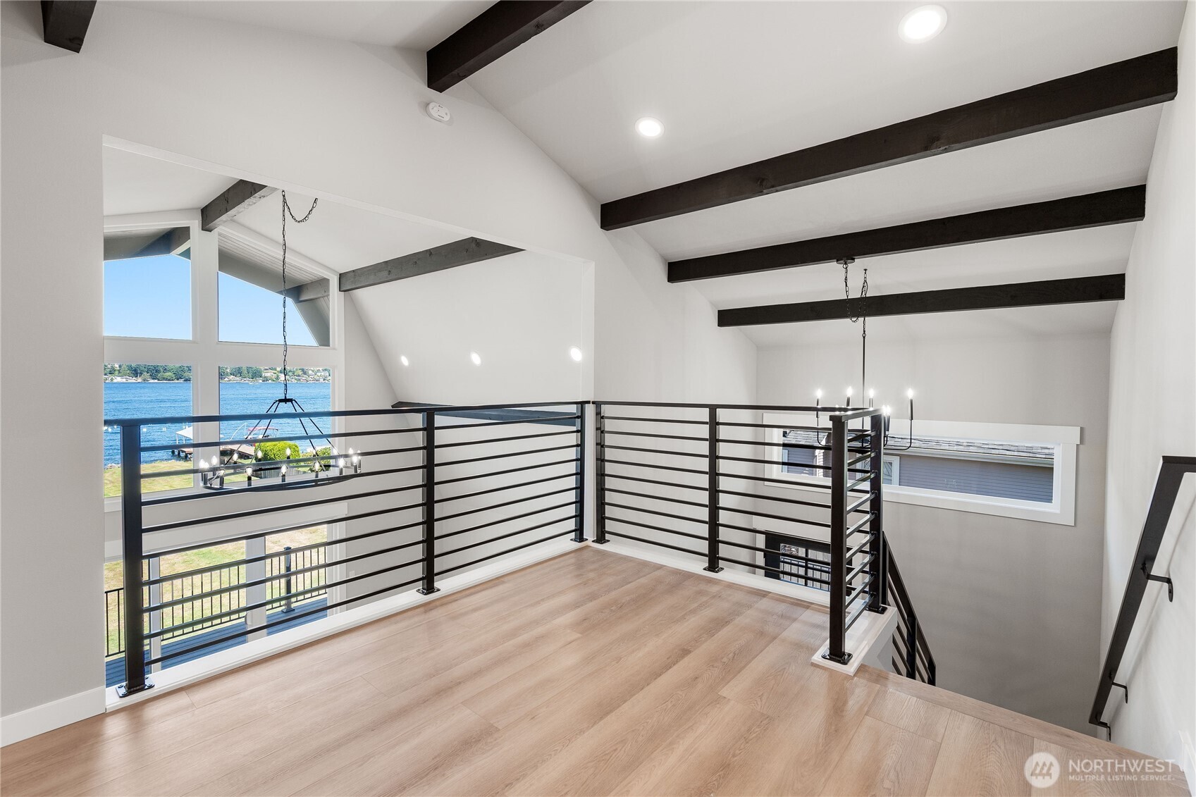 10005 North Davies Road Lake Stevens, WA 98258 - Photo 24 of 40 a view of a hallway with stairs and a chandelier
