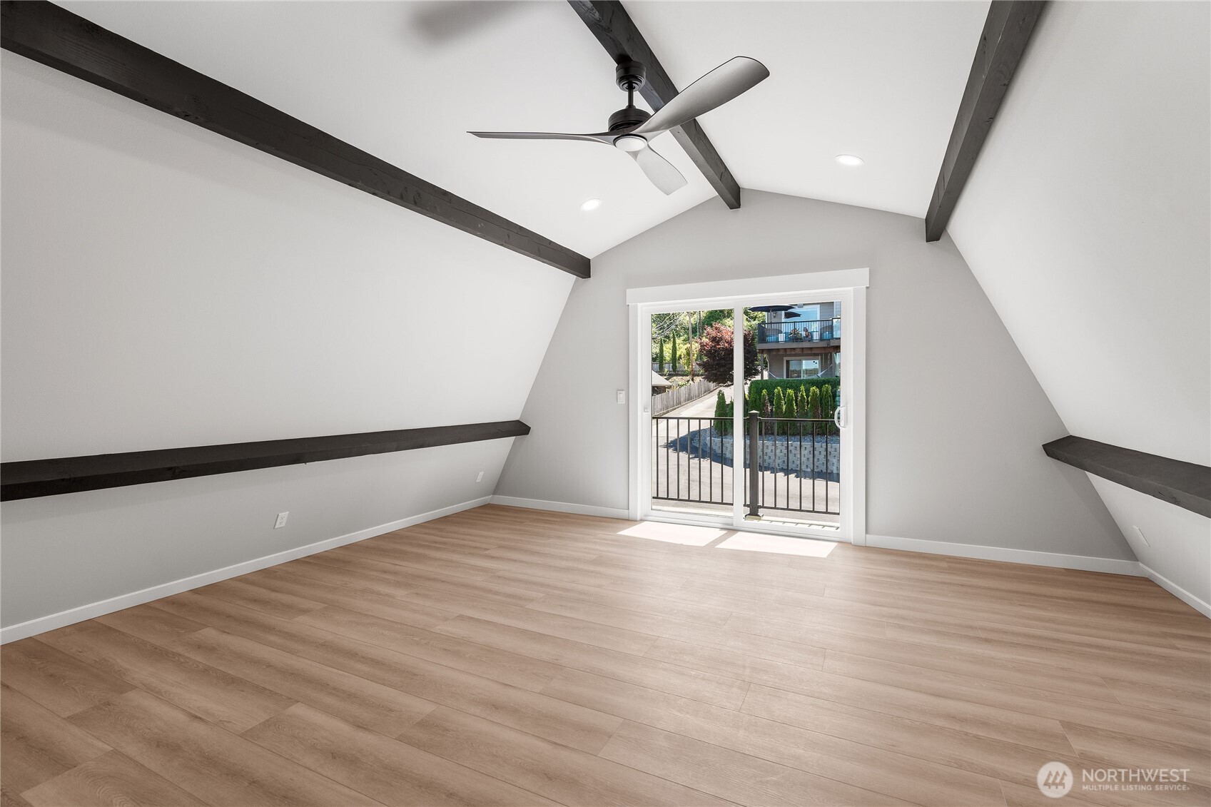 10005 North Davies Road Lake Stevens, WA 98258 - Photo 26 of 40 a view of an empty room with wooden floor and a window