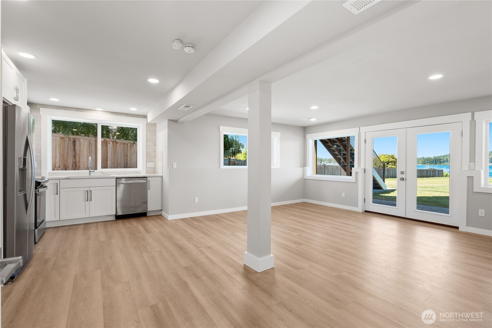 10005 North Davies Road Lake Stevens, WA 98258 - Photo 28 of 40 a view of a big room with wooden floor and windows