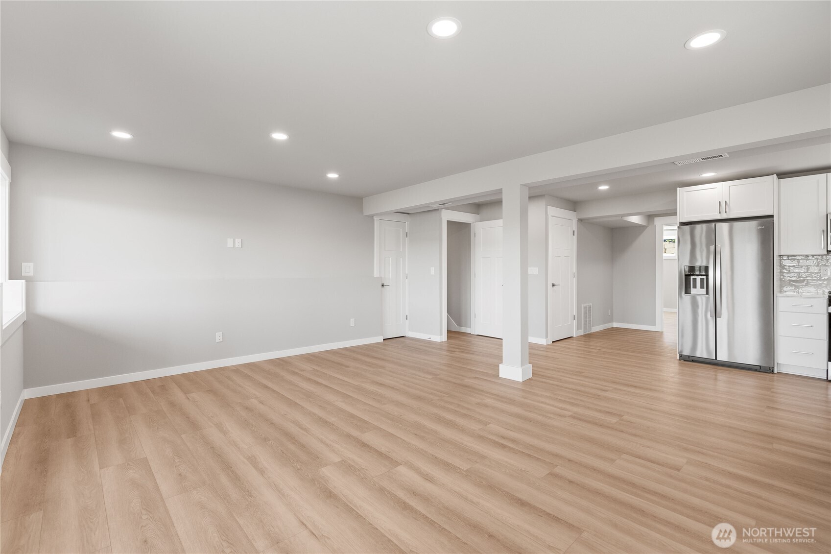 10005 North Davies Road Lake Stevens, WA 98258 - Photo 30 of 40 a view of an empty room with wooden floor