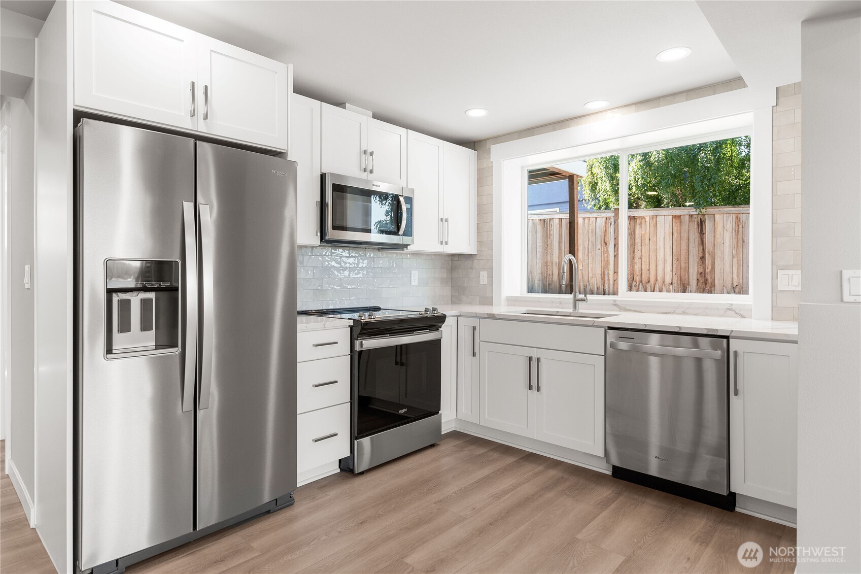 10005 North Davies Road Lake Stevens, WA 98258 - Photo 31 of 40 a kitchen with stainless steel appliances a refrigerator sink and microwave