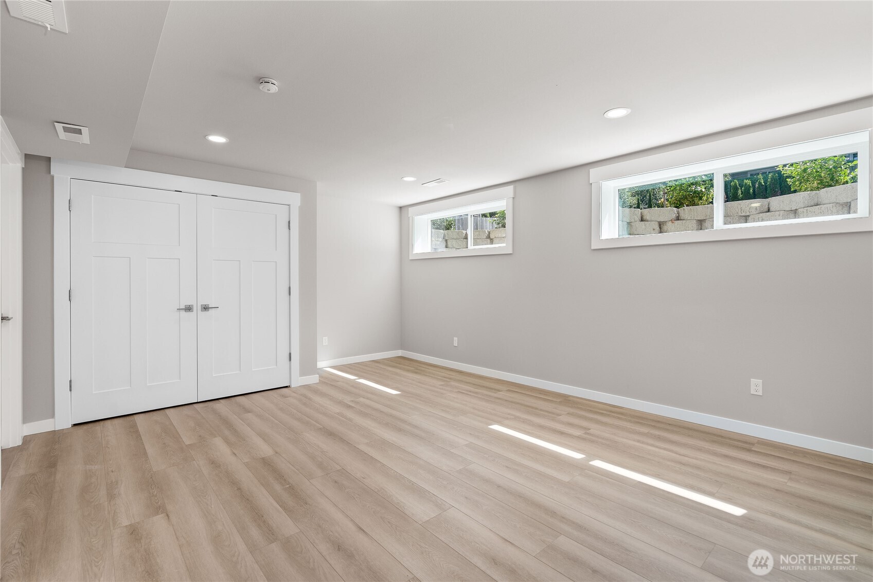 10005 North Davies Road Lake Stevens, WA 98258 - Photo 33 of 40 a view of an empty room with wooden floor