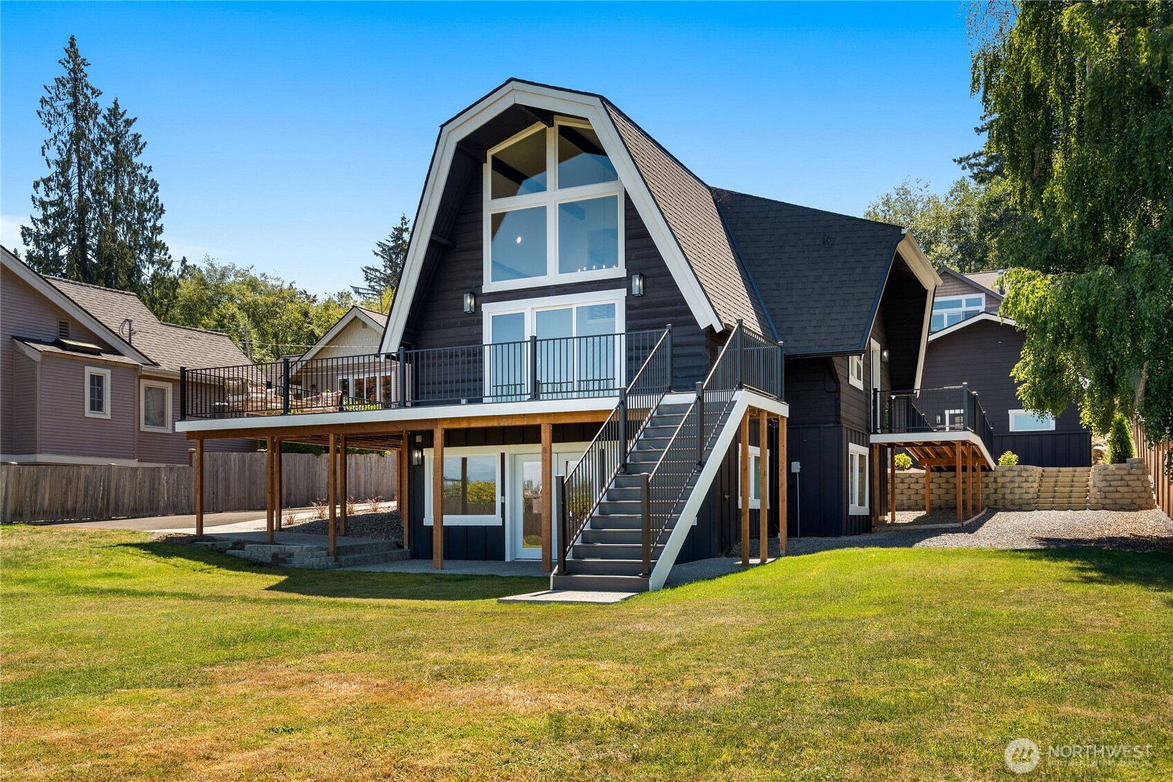 10005 North Davies Road Lake Stevens, WA 98258 - Photo 34 of 40 a view of a house with swimming pool in front of it