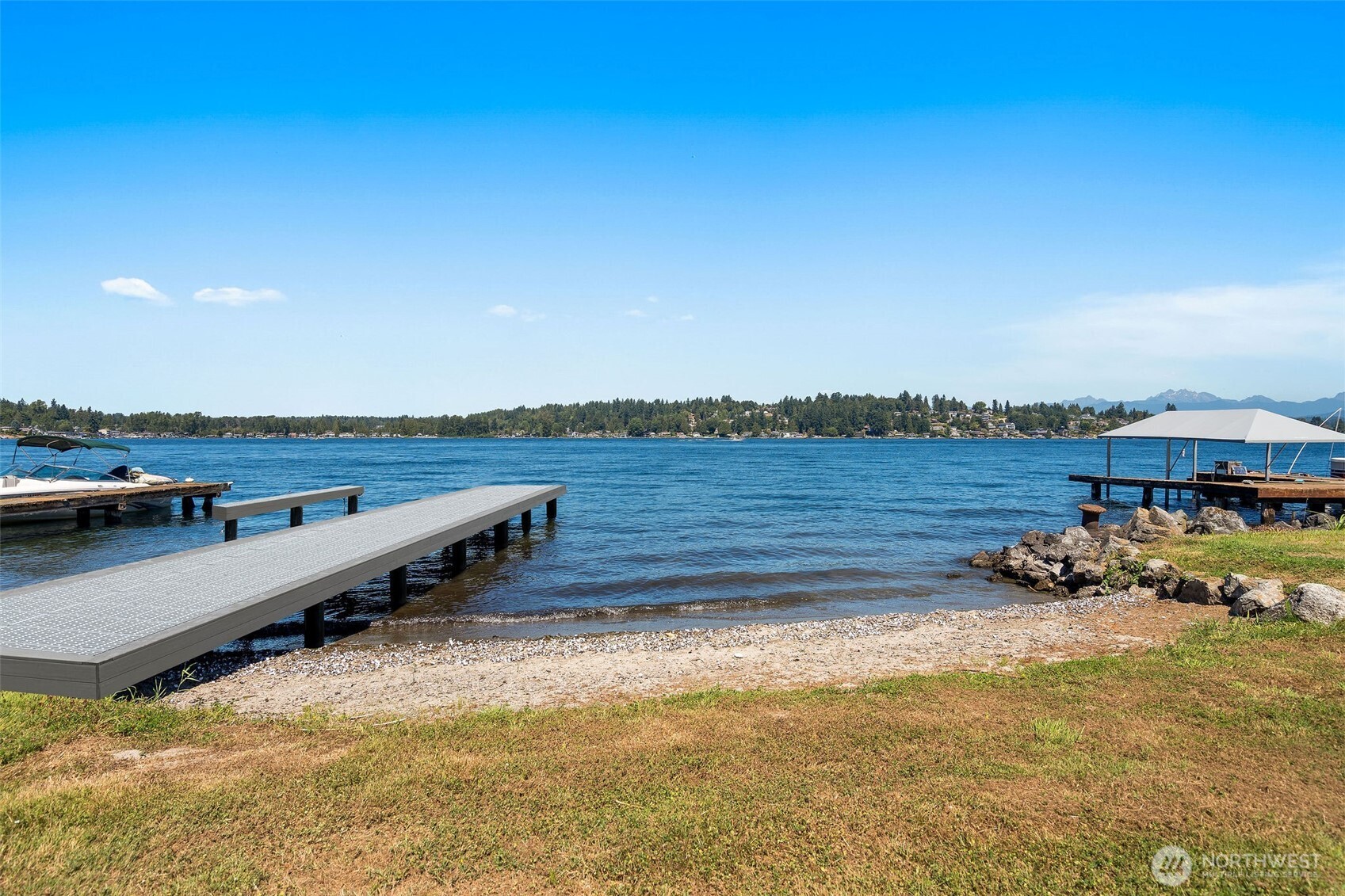 10005 North Davies Road Lake Stevens, WA 98258 - Photo 38 of 40 a view of a lake with houses in the back
