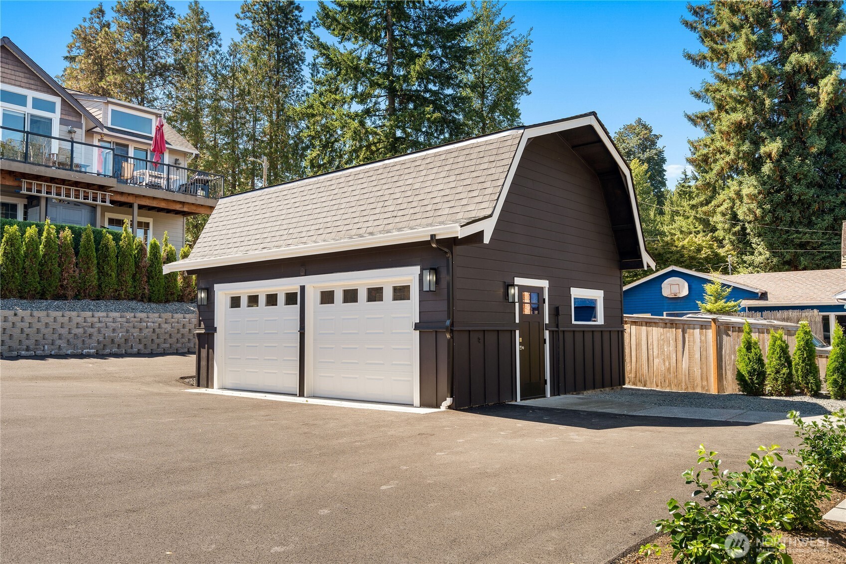 10005 North Davies Road Lake Stevens, WA 98258 - Photo 7 of 40 a front view of a house with a yard and garage