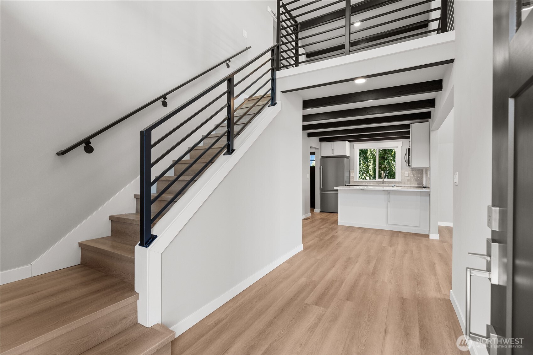 10005 North Davies Road Lake Stevens, WA 98258 - Photo 9 of 40 a view of kitchen and hallway with wooden floor
