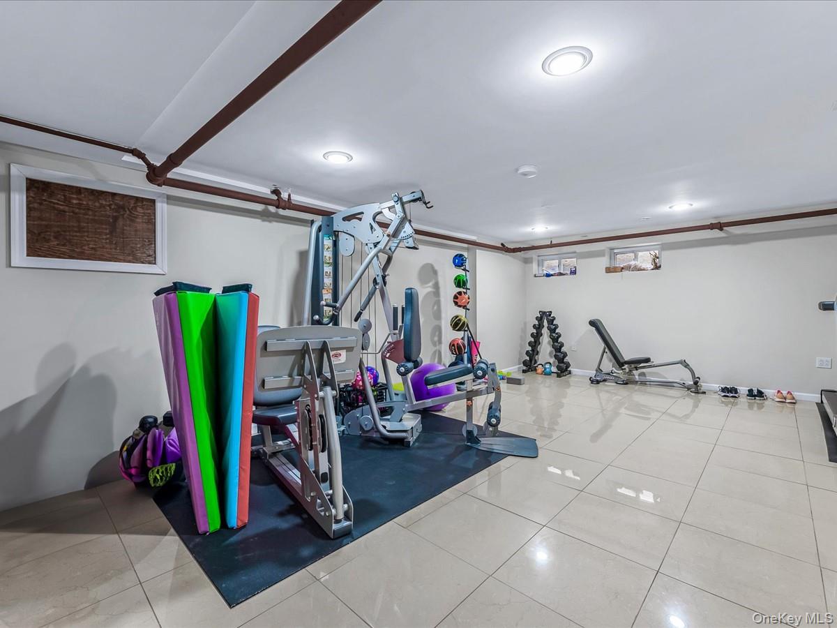 219-08 38th Avenue Queens, NY 11361 - Photo 17 of 24 a view of a room with gym equipment