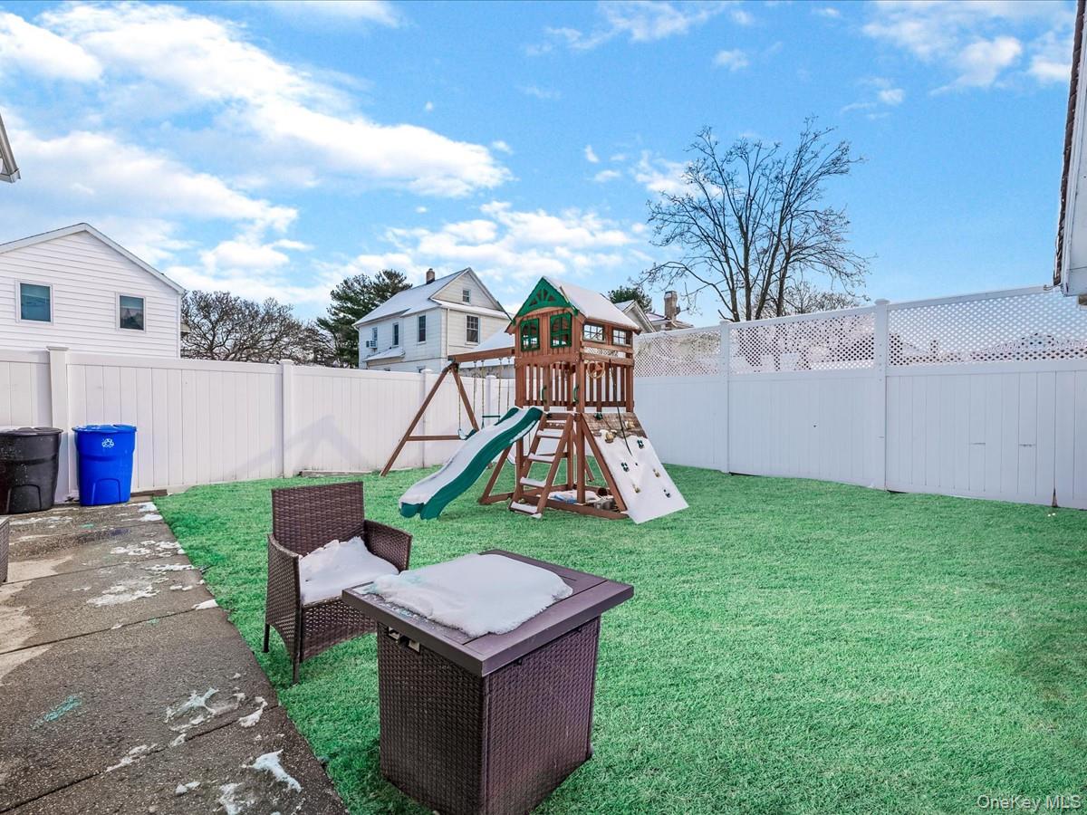 219-08 38th Avenue Queens, NY 11361 - Photo 22 of 24 a view of a garden with a slide
