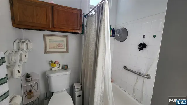 a white toilet sitting next to a bathroom sink