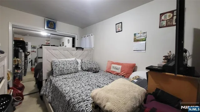 a bed room with a bed window and a couch