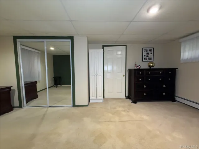 a room with a dresser and a mirror