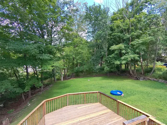 a view of a deck with a yard