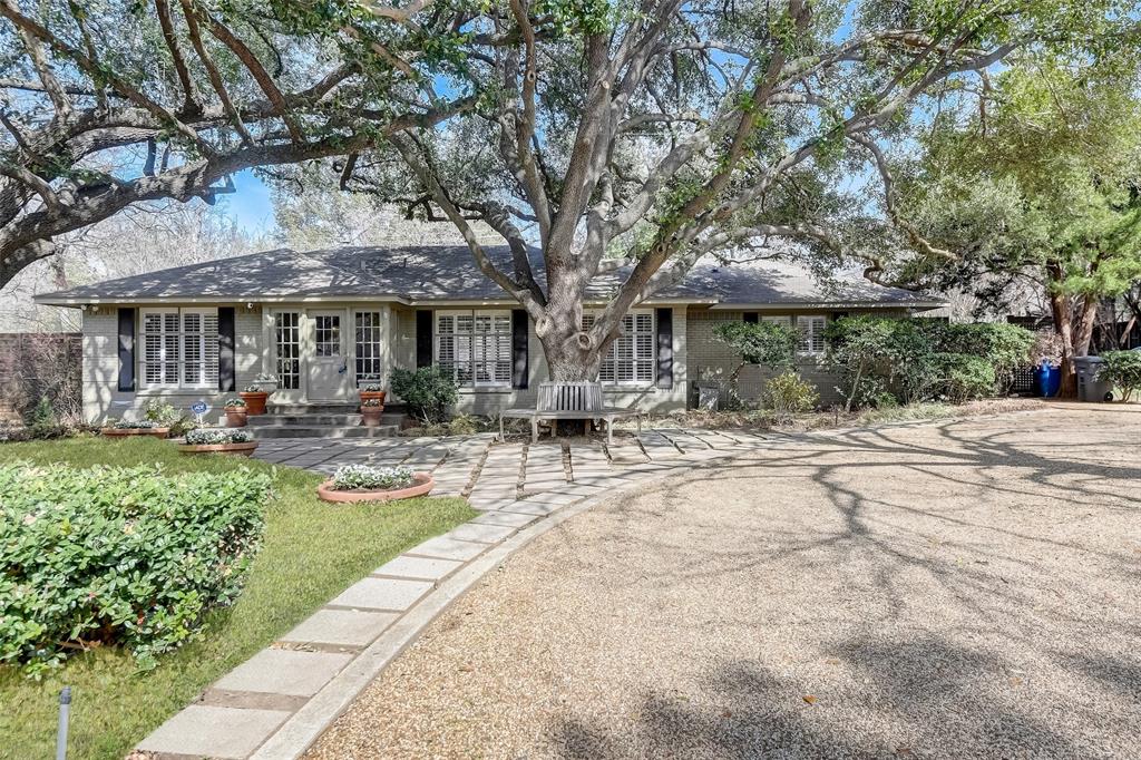 a view of a house with backyard porch and sitting area
