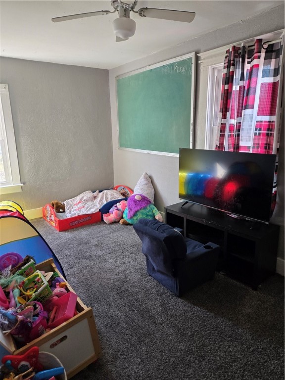 1831 East Clay Street Decatur, IL 62521 - Photo 7 of 15 a living room with a bed furniture and a flat screen tv