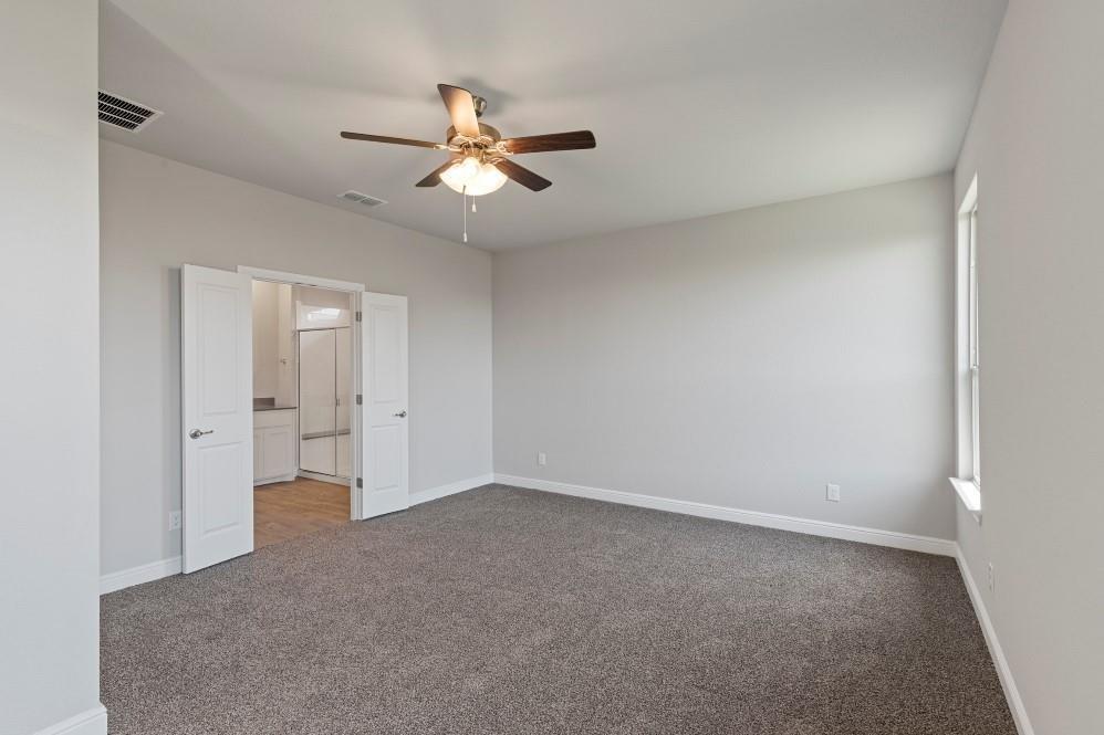130 Lunayena Road Rhome, TX 76078 - Photo 18 of 39 a view of an empty room and chandelier fan