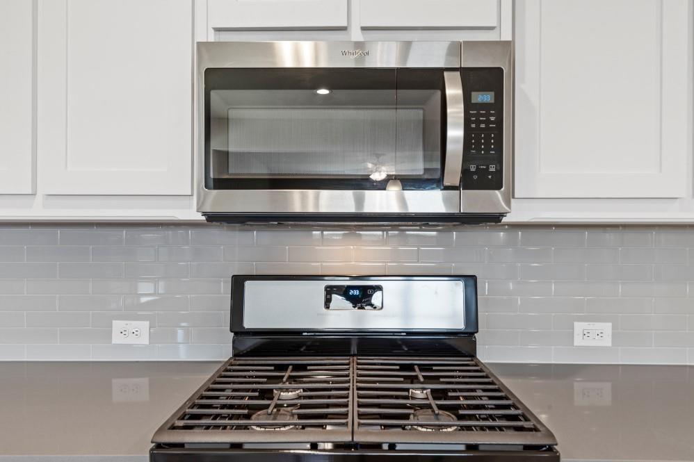 130 Lunayena Road Rhome, TX 76078 - Photo 5 of 39 a stove top oven sitting inside of a kitchen
