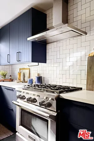 a kitchen with a stove and a sink