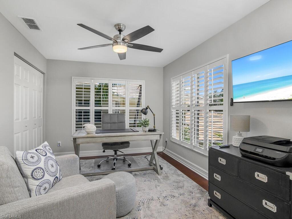 816 Carrick Bend Circle, Unit 202 Naples, FL 34110 - Photo 41 of 50 Office area and or den, with hardwood flooring