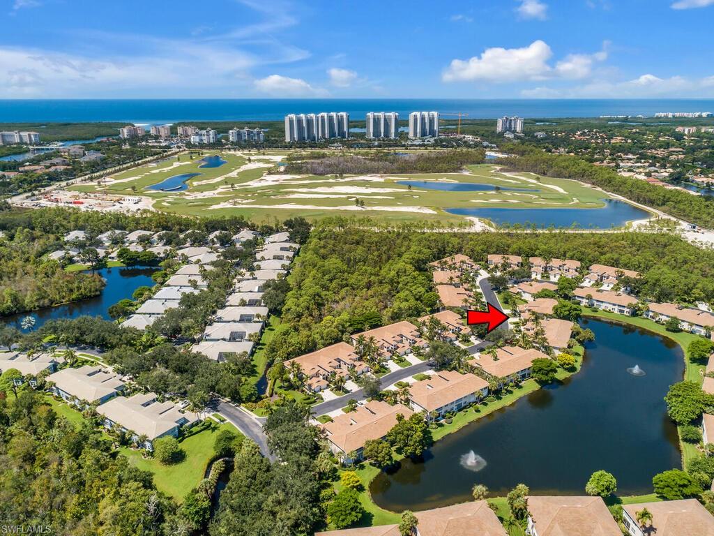 816 Carrick Bend Circle, Unit 202 Naples, FL 34110 - Photo 50 of 50 Bird's eye view of a nearby body of water and a golf club