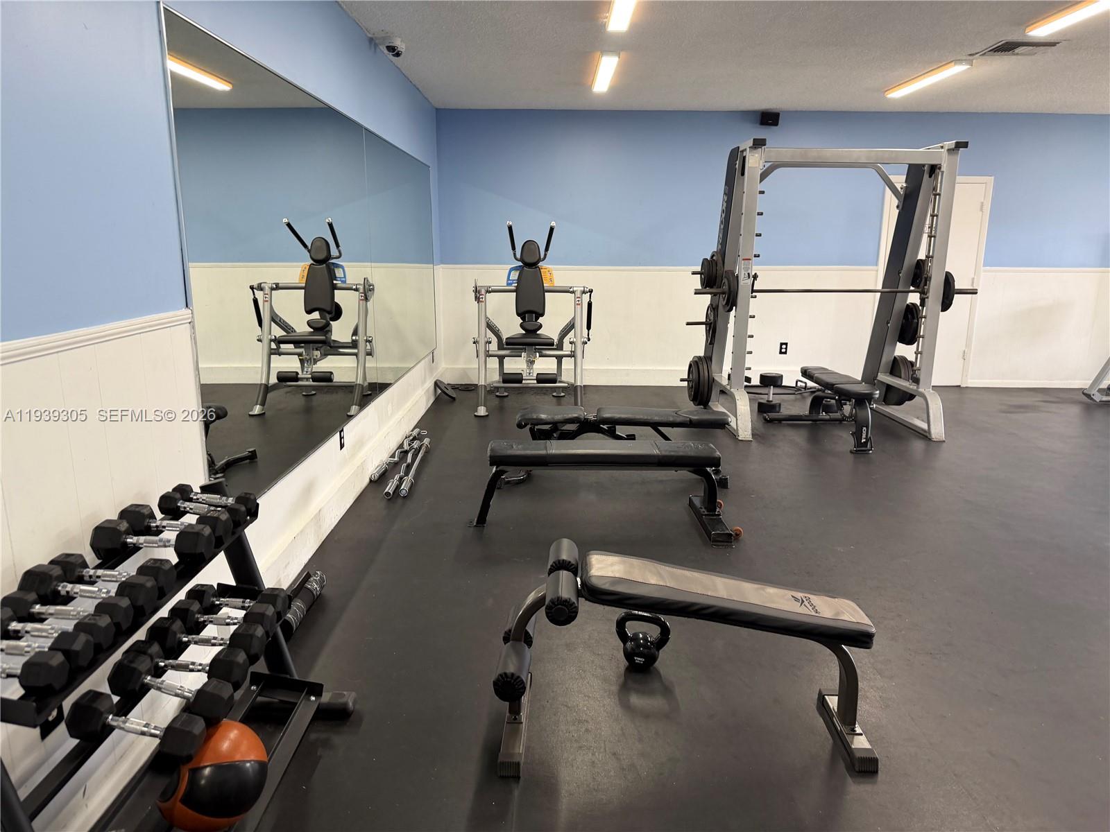 8111 Southwest 129th Avenue Miami, FL 33183 - Photo 11 of 20 a room with gym equipment and a window