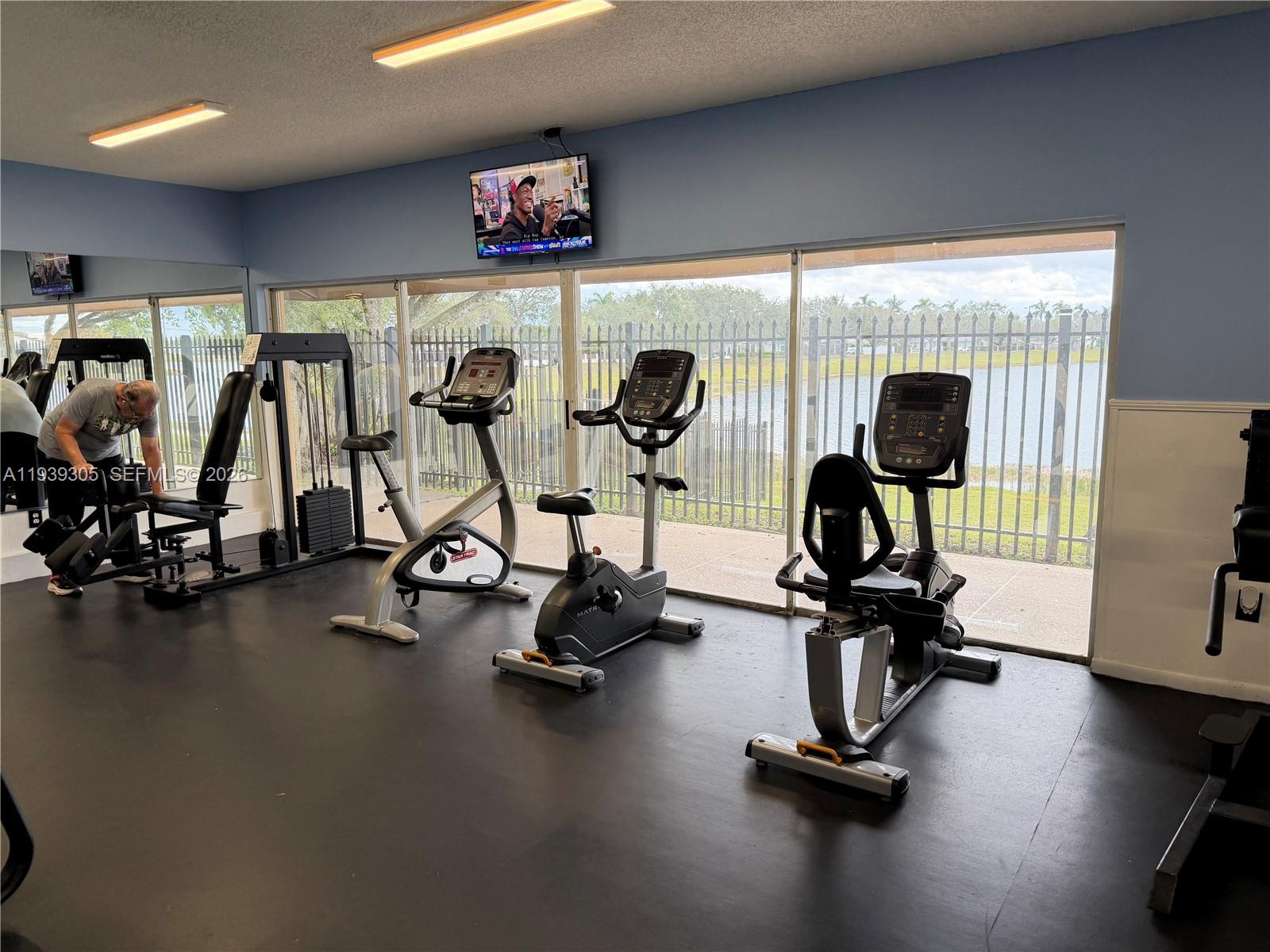 8111 Southwest 129th Avenue Miami, FL 33183 - Photo 12 of 20 a view of a room with gym equipment