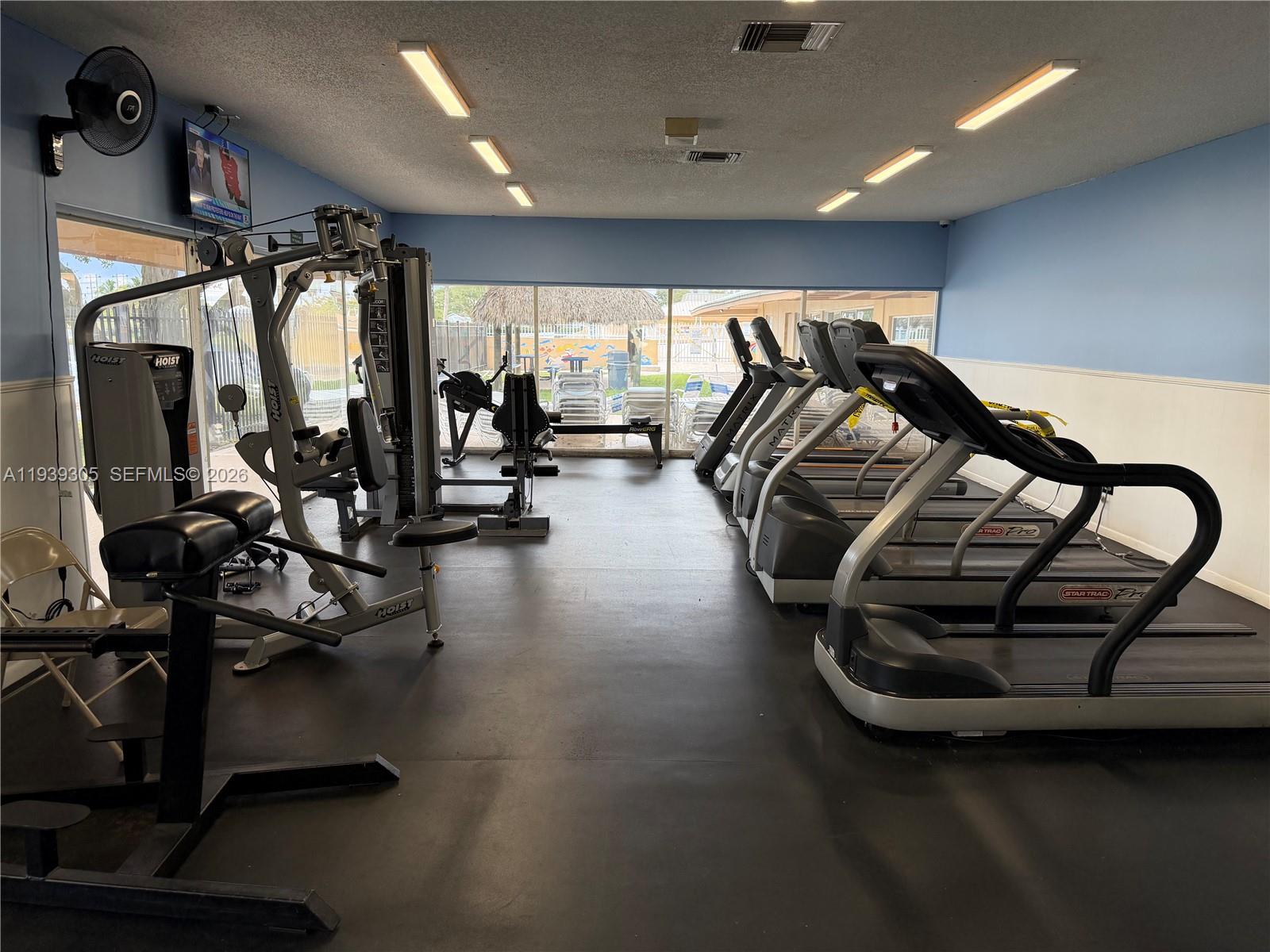 8111 Southwest 129th Avenue Miami, FL 33183 - Photo 13 of 20 a view of a room with gym equipment