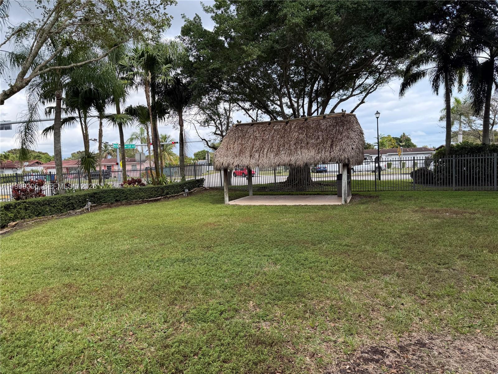 8111 Southwest 129th Avenue Miami, FL 33183 - Photo 15 of 20 a view of a yard with a house in the background