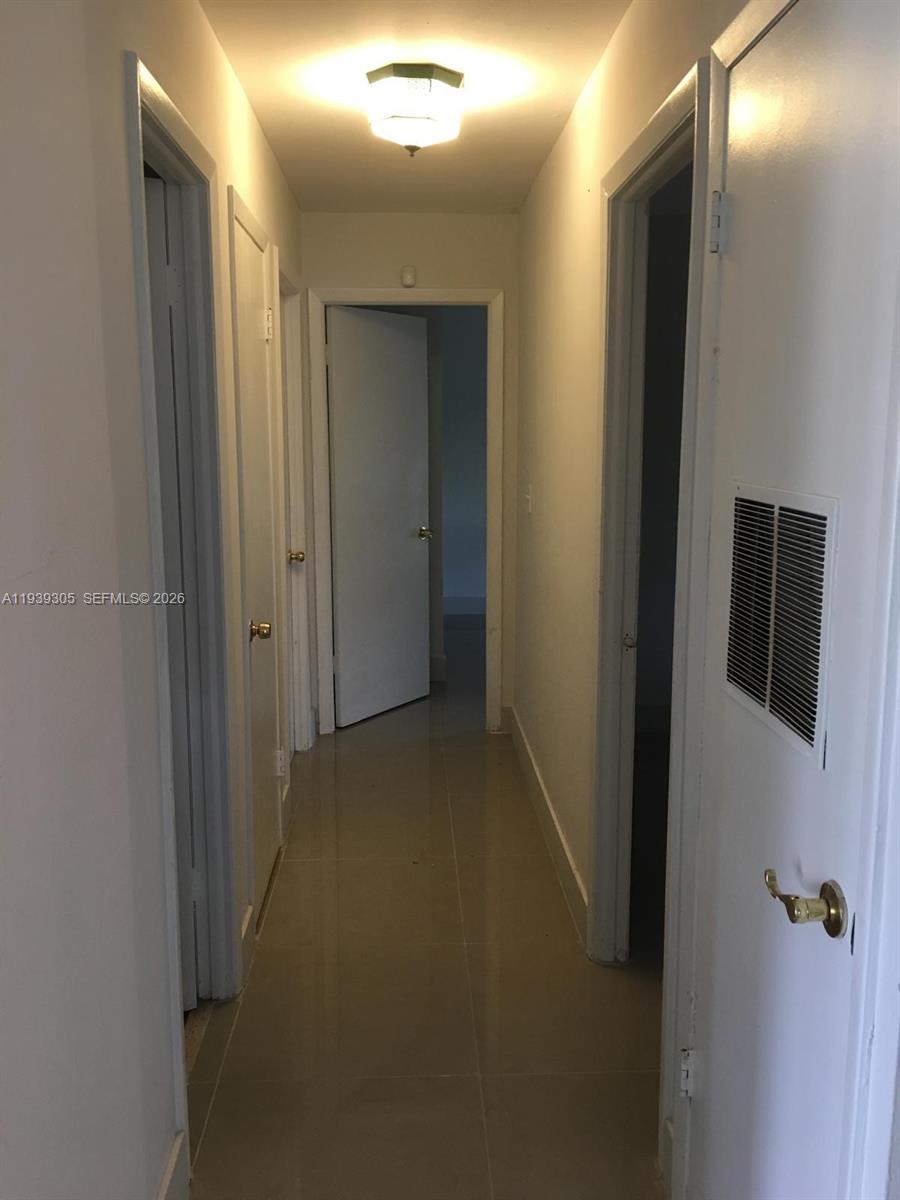 8111 Southwest 129th Avenue Miami, FL 33183 - Photo 3 of 20 a view of hallway with shower