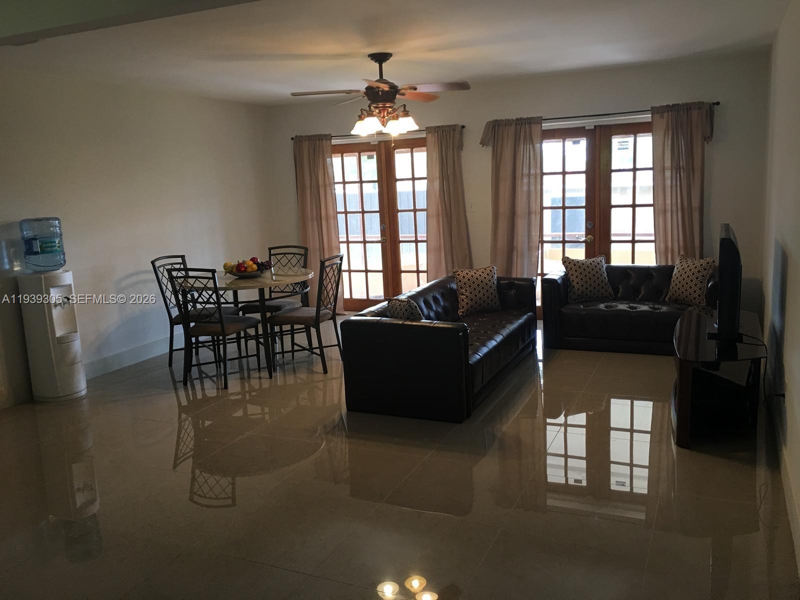 8111 Southwest 129th Avenue Miami, FL 33183 - Photo 5 of 20 a living room with furniture and a large window