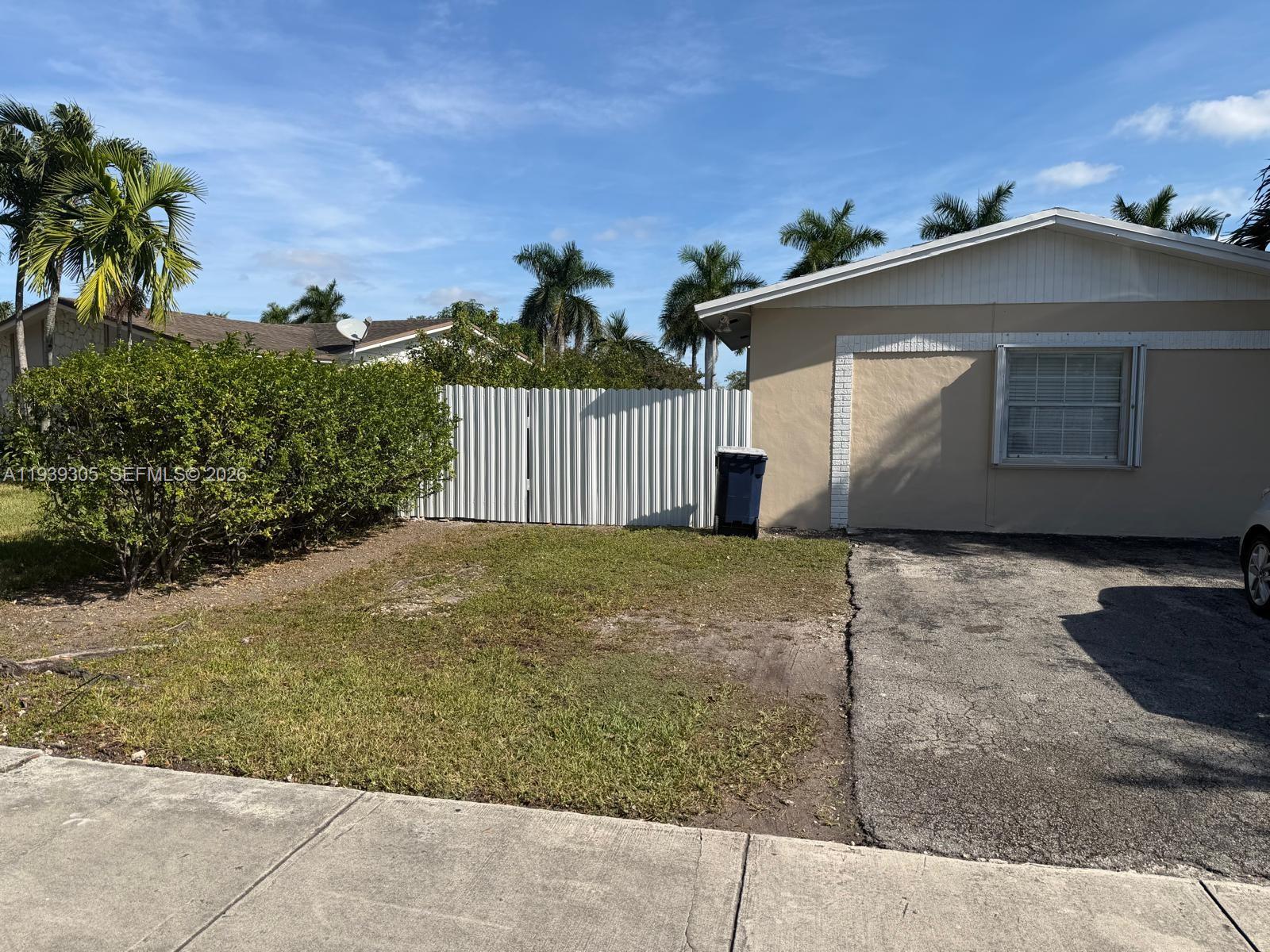 8111 Southwest 129th Avenue Miami, FL 33183 - Photo 6 of 20 a view of a house with a yard