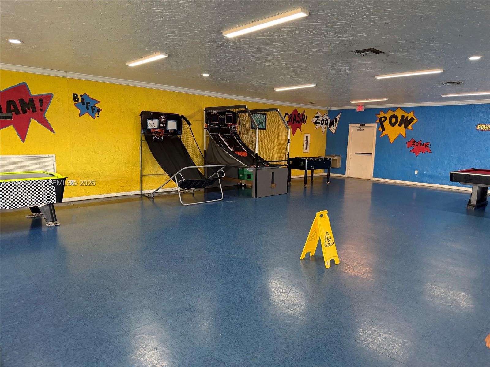 8111 Southwest 129th Avenue Miami, FL 33183 - Photo 9 of 20 a view of a room with gym equipment with wooden floor