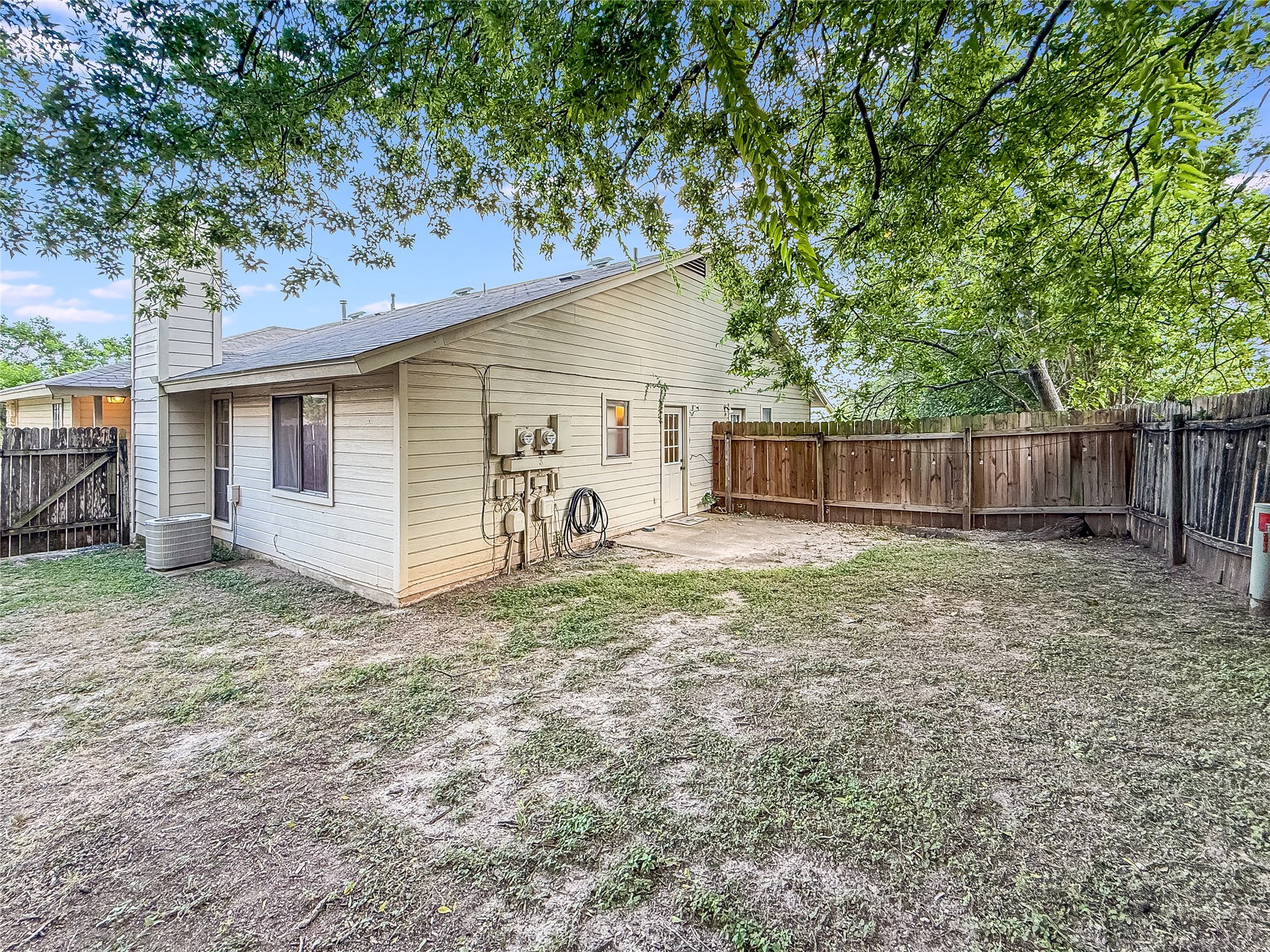 2014 Alex Avenue, Unit B Austin, TX 78728 - Photo 22 of 24 Backyard with a covered Wooden Fence