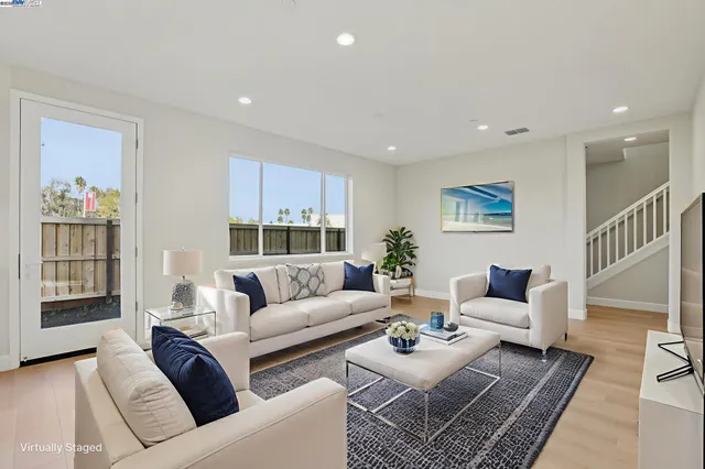 a living room with furniture and a couch