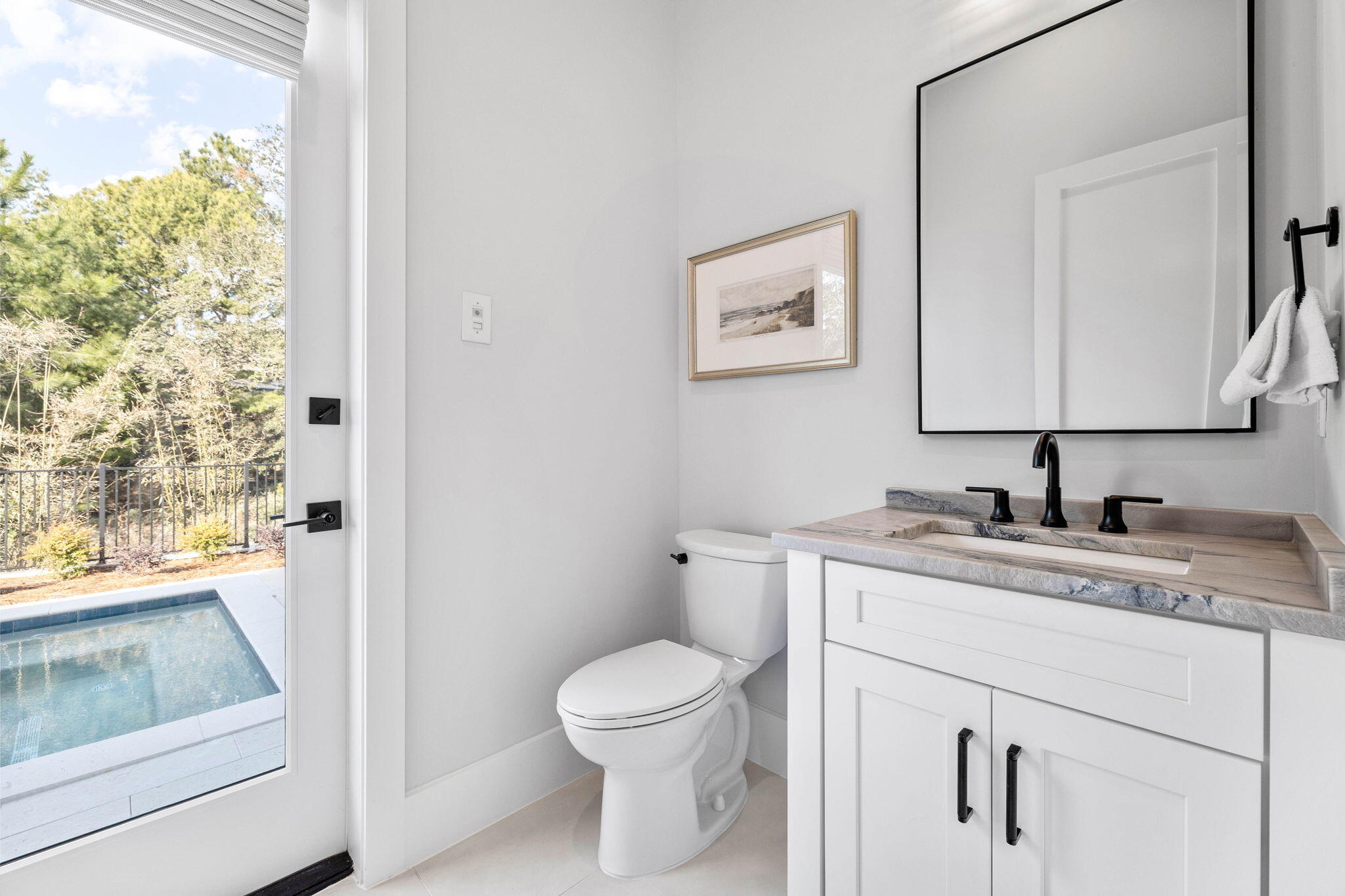 54 Marthas Lane Santa Rosa Beach, FL 32459 - Photo 13 of 59 a bathroom with a granite countertop toilet sink and mirror
