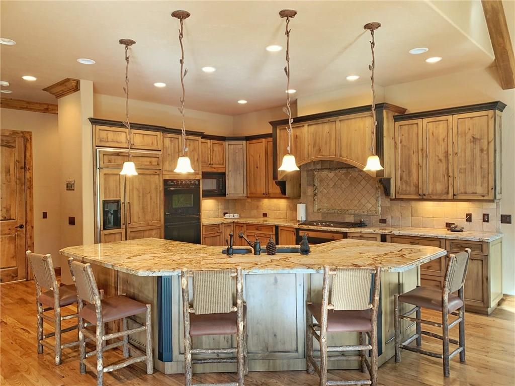 79 Rounds Road Breckenridge, CO 80424 - Photo 7 of 11 a kitchen with a table chairs stove and microwave