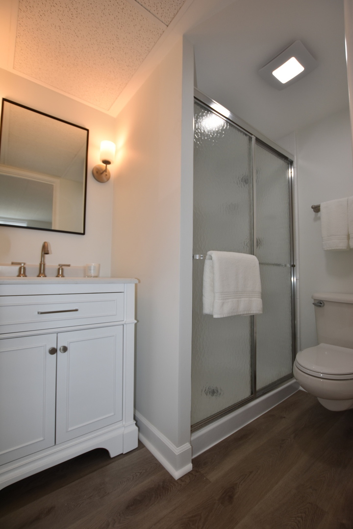 110 West Butterfield Road, Unit 506S Elmhurst, IL 60126 - Photo 21 of 30 a bathroom with a sink a toilet and mirror
