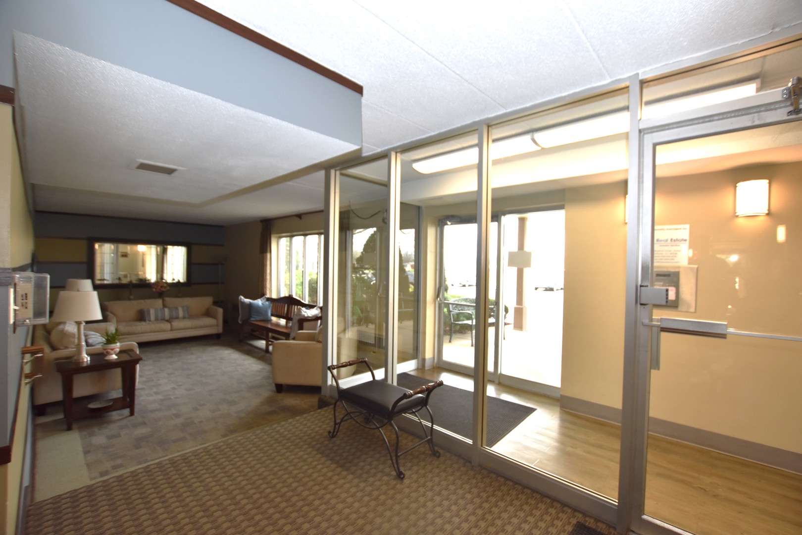 110 West Butterfield Road, Unit 506S Elmhurst, IL 60126 - Photo 5 of 30 a living room with furniture and large windows