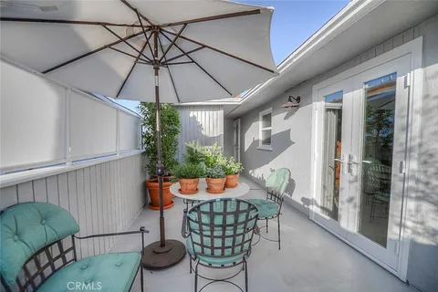 a table and chairs in the balcony
