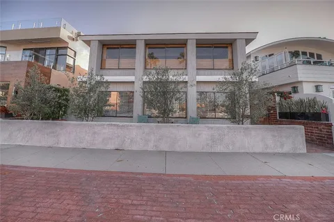 a front view of building with yard