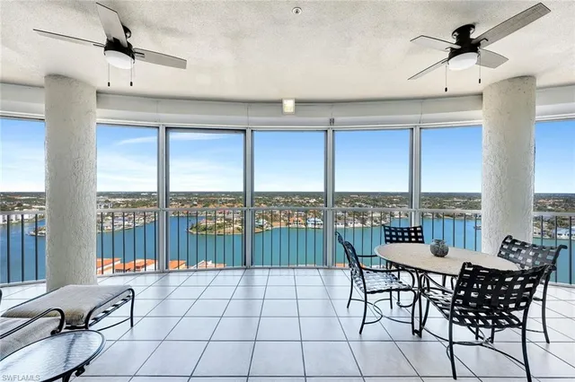 a outdoor space with lots of furniture and windows