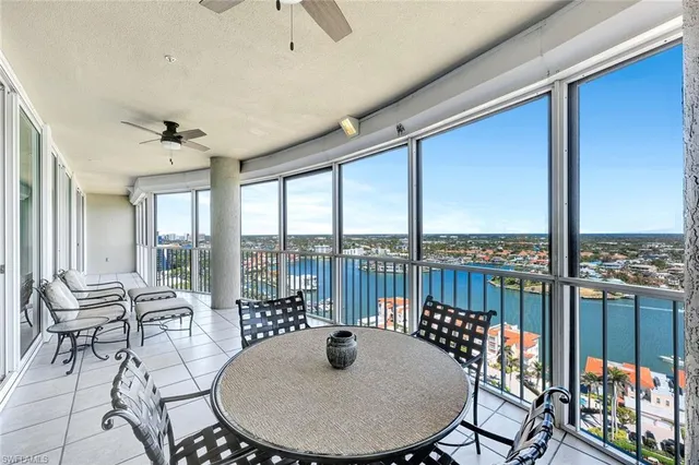 a dining room with furniture window and outside view
