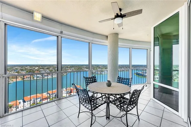 a view of a balcony with furniture