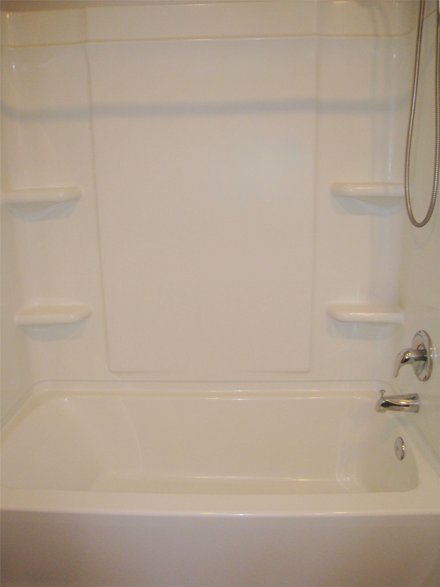 229 Geode Glen Maxwell, TX 78656 - Photo 13 of 19 A pristine bathtub and shower combination awaits a refreshing soak.