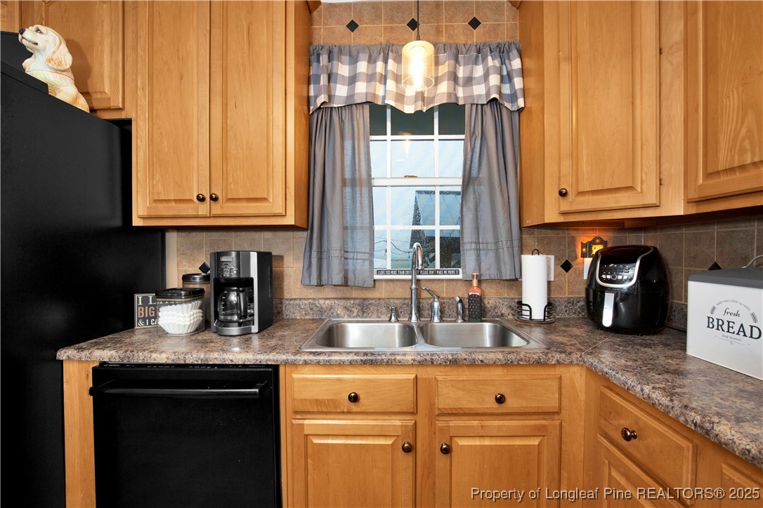 4891 Wade-Stedman Road Wade, NC 28395 - Photo 11 of 46 a kitchen with granite countertop cabinets and window